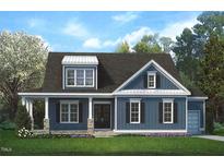Two-story house with blue siding, stone accents, and a covered porch at 5124 Grist Stone Way, Youngsville, NC 27596