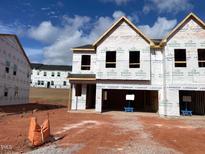 New construction home with wrap-around porch at 2217 Tulip Bloom Ln, Morrisville, NC 27560