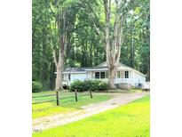 Charming ranch home nestled on a wooded lot with a spacious yard at 325 Ranch Farm Rd # A - B, Raleigh, NC 27603