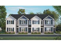 Three-unit townhome building with gray and white siding at 131 Holmes Corner Dr, Smithfield, NC 27577