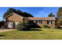 Brick ranch house with attached two-car garage at 66 Hardy Rd, Wendell, NC 27591