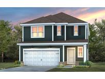 Two-story dark green house with white garage door and light-colored accents at 2892 Huxley Way, Apex, NC 27502