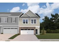 Two-story townhouse with a stone facade and two-car garage at 7128 Hubner Pl # 35, Cary, NC 27519