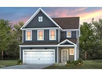 Two-story home with gray siding and a white garage door at 2864 Huxley Way, Apex, NC 27502