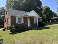 Brick ranch house with a covered porch at 2222 Sunset Hills Dr, Burlington, NC 27215