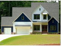 Two-story farmhouse with white siding and blue accents at 4332 Coldwater Springs Dr, Raleigh, NC 27616