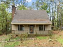 A charming one-story house with a covered porch at 2980 Tram Rd, Fuquay Varina, NC 27526