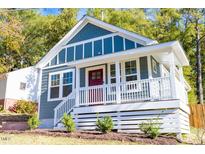 Charming craftsman style home with gray siding and red door at 831 Ridgeway Ave, Durham, NC 27701