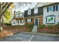 Brick townhouse with a charming front entrance and landscaping at 1321 Dylan Heath Ct, Raleigh, NC 27608