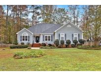 Gray house with a large front yard and landscaping at 198 Hillsdale Dr, Archer Lodge, NC 27527