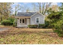 Gray house with a small front porch and yard at 4505 Laymans Chapel Rd, Durham, NC 27704