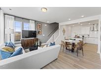 Open living room featuring contemporary furniture and large windows at 10537 Pleasant Branch Dr # 101, Raleigh, NC 27614