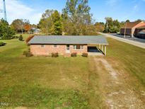 Brick ranch house with carport and spacious yard at 200 W B St, Erwin, NC 28339