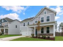 Two-story house with gray siding, stone accents, and a front porch at 280 Umstead St, Sanford, NC 27330