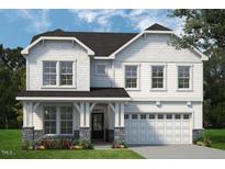 Two-story house with white siding, gray roof, and stone accents at 8740 Maxine St # 7 Selma, Willow Springs, NC 27592