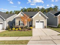 Craftsman style home with stone accents and landscaped front yard at 1216 White Flint Cir, Durham, NC 27703