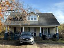 Charming one-story home with front porch and mature trees at 716 Everett St, Burlington, NC 27215