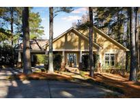 Craftsman style home with covered porch and landscaped yard at 318 Rawls Church Rd, Angier, NC 27501