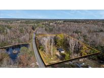 Aerial view of a single-Gathering home on a wooded lot at 1970 Old Us Hwy 64, Spring Hope, NC 27882