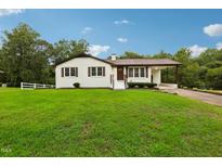 Charming ranch home with a spacious lawn and driveway at 2112 Eastwood Dr, Durham, NC 27703