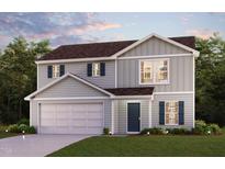 Two-story house with gray siding, two-car garage, and landscaping at 7611 Redpoll Ct, Snow Camp, NC 27349