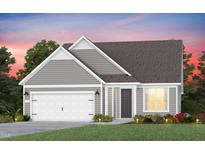 Two-story house with gray siding, white garage door, and landscaping at 2321 Forsythia Trl, Fuquay Varina, NC 27526