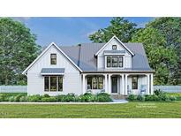 Two-story farmhouse with gray roof and white siding, rocking chairs on porch at 4025 Hamlets Chapel Rd, Pittsboro, NC 27312