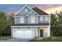 Two-story home with gray siding, white garage door, and landscaping at 2782 Farmhouse Dr, Apex, NC 27502