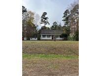 Ranch style home with a large front yard and covered porch at 6232 Dawn Dr, Hurdle Mills, NC 27541