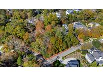 Aerial view of a wooded lot in a residential neighborhood at 906 Marlowe Rd, Raleigh, NC 27609