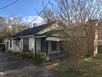 One-story house with a front porch and a yard at 2219 Fitzgerald Ave, Durham, NC 27707