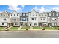 New townhouses with modern design, featuring multiple units and landscaping at 2239 Horton Park Dr, Apex, NC 27539