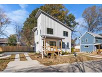 Modern two-story home with white siding and a detached garage at 2503 Lednum St, Durham, NC 27704