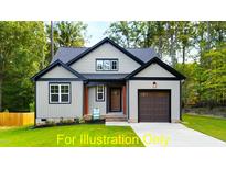 Craftsman style home with two-car garage and landscaped lawn at 117 Deer Cross Dr, Louisburg, NC 27549