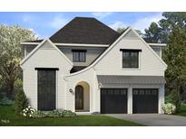 Two-story home with white brick exterior, black garage doors, and landscaping at 307 S Elm St, Apex, NC 27502