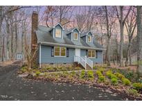 Newly renovated home with gray siding and landscaping at 622 Knight Dr, Durham, NC 27712