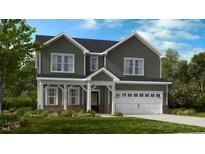 Two-story house with gray siding, white trim, and a two-car garage at 1132 Sun Springs Rd, Wake Forest, NC 27587