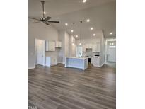 Open concept kitchen with island and stainless steel appliances at 115 Lemon Drop Ln, Franklinton, NC 27525