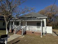 Charming renovated home featuring a front porch and landscaped yard at 708 E Highland Ave, Rocky Mount, NC 27801