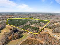 Aerial view of a large land with lush forest and open fields at 2001 Wheelers Church Rd Rd, Hurdle Mills, NC 27541