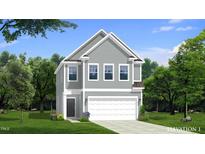 Two-story house with gray siding, white garage door, and landscaping at 1011 Shovelhead Dr # 6, Durham, NC 27703