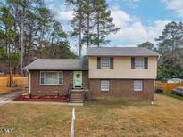 Brick two-story house with a landscaped yard at 4612 Limerick Dr, Raleigh, NC 27604