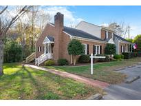 Brick home with landscaped yard and walkway at 113 Granby Ct, Cary, NC 27511