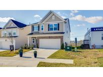 Two-story house with a neutral color palette and a two-car garage at 167 S Finley Landing Pkwy, Smithfield, NC 27577