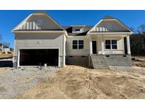 New construction home with attached garage and raised foundation at 19 Covey Rise Way, Lillington, NC 27546