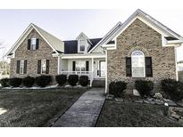 Brick home with landscaped yard and walkway at 4633 Lily Walk, Rocky Mount, NC 27804