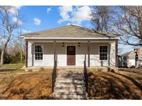 Charming renovated home with a covered front porch and updated siding at 112 Edgewood Dr, Roxboro, NC 27573