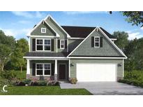 Charming two-story green home with a welcoming front porch and attached garage at 75 Malbec Way, Youngsville, NC 27596