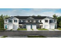 Attractive townhomes with garages, white and blue siding, and green landscaping at 10554 Brookside Reserve Rd, Raleigh, NC 27614