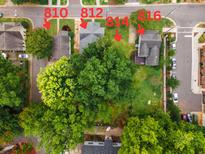Aerial view showing home's location near other houses and green spaces at 810 Brooklyn St, Raleigh, NC 27605